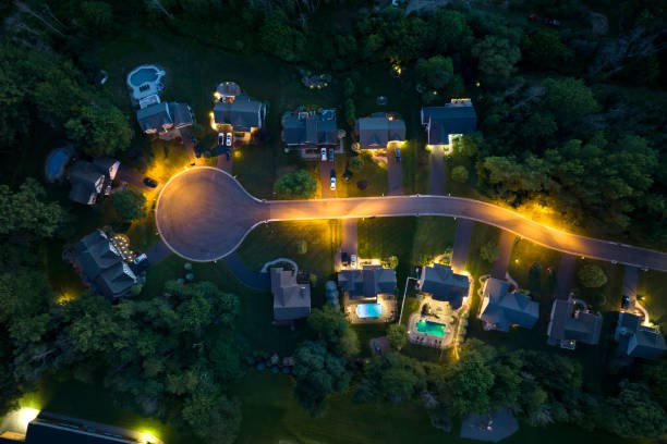 Room Must be Made cover: an aerial view of a lamplit suburban cul-de-sac at night.